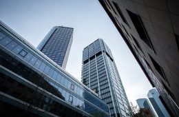 A low angle shot of high rise buildings under the clear sky in Frankfurt, Germany